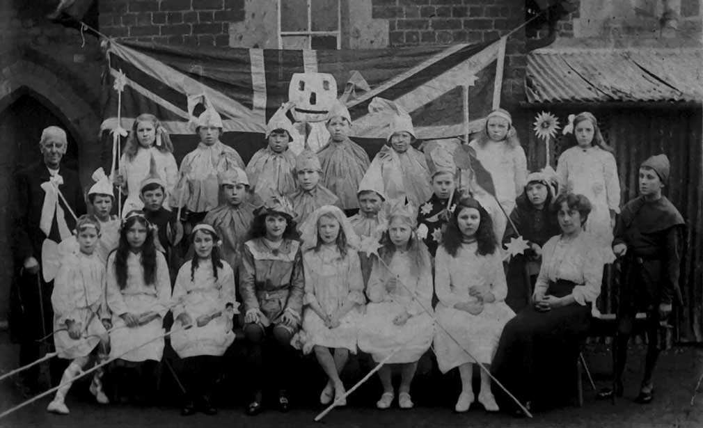 An old photograph, of the children at Broadwas School, dressed for a concert.