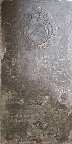 17th-century pews, one bearing the letters  C C on a shield