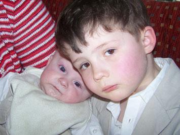 Jacob Holland holding his cousin Finley Holland.