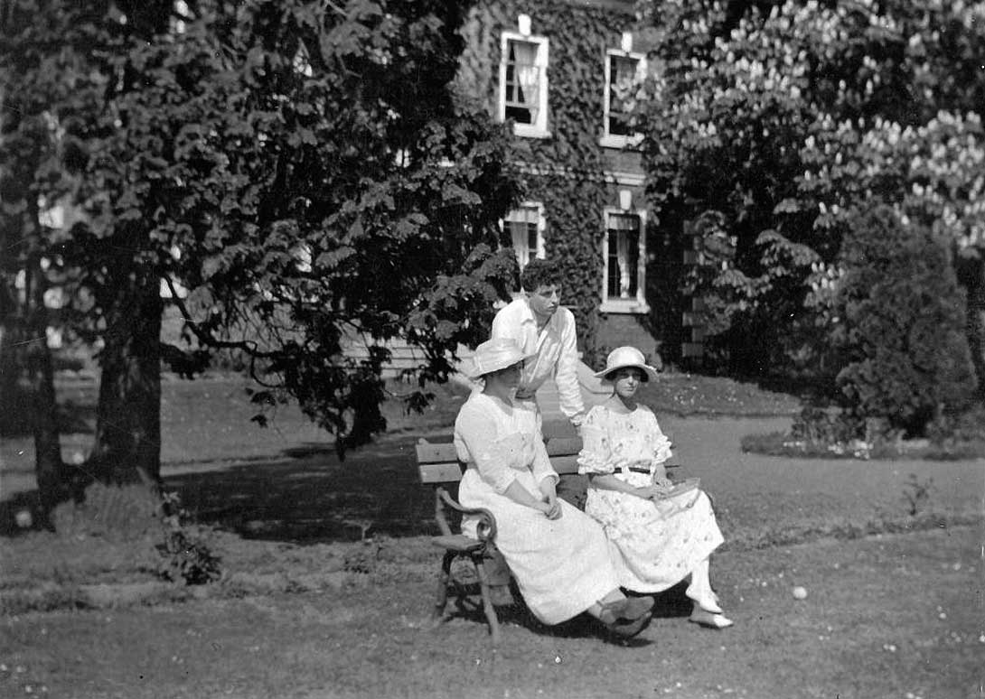 Francis Cuthbert Jones, (my uncle) standing by his aunt Winnie (Annie Elizabeth {Jones} Wilkinson) and her step-daughter Norah Ellison Wilkinson, all seen relaxing in the gardens of Broadwas Court.